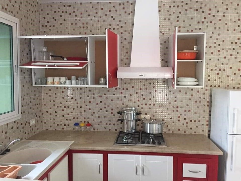 Full-size fridge, cookware/dishes/utensils, cleaning supplies, freezer