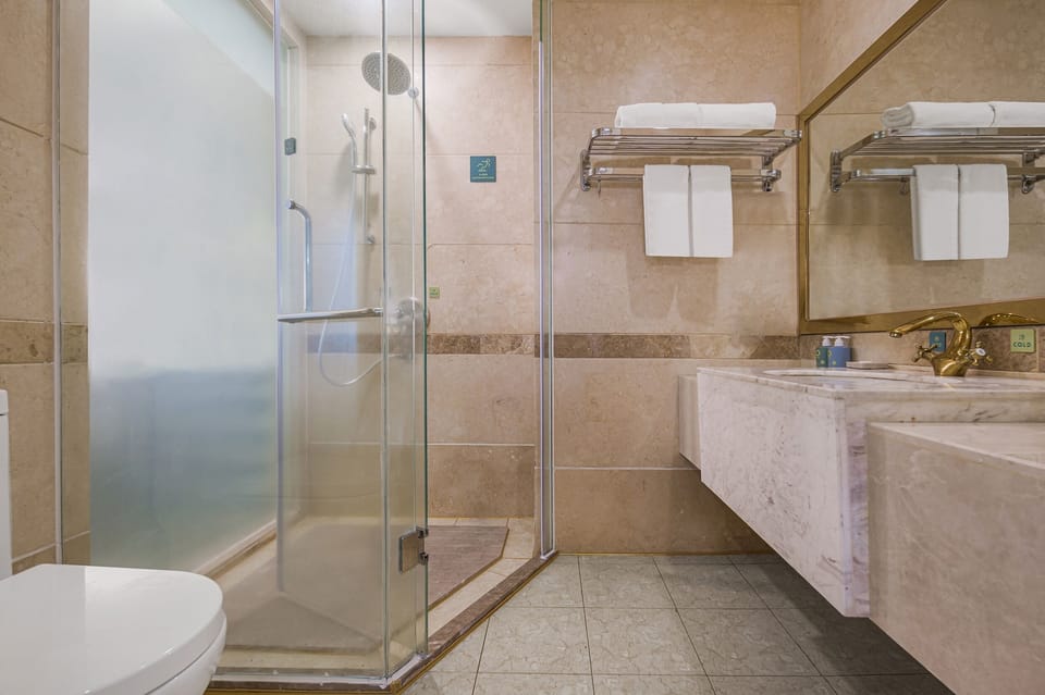 Shower, free toiletries, hair dryer, slippers