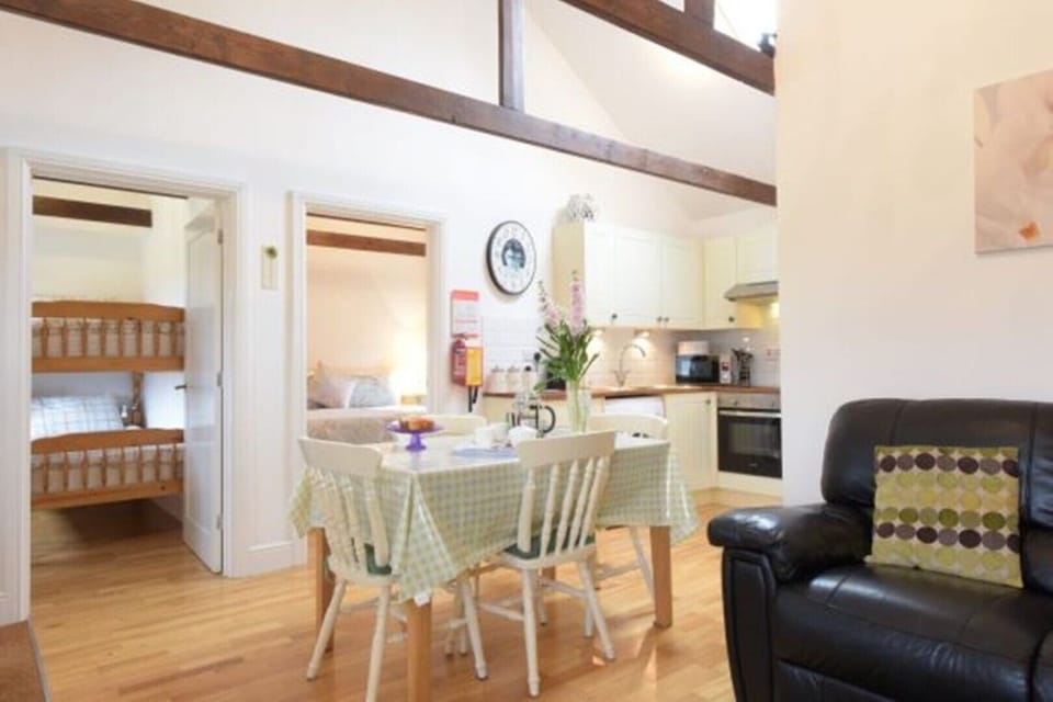 Open plan lounge dinner exposed beams to give a real barn feel.