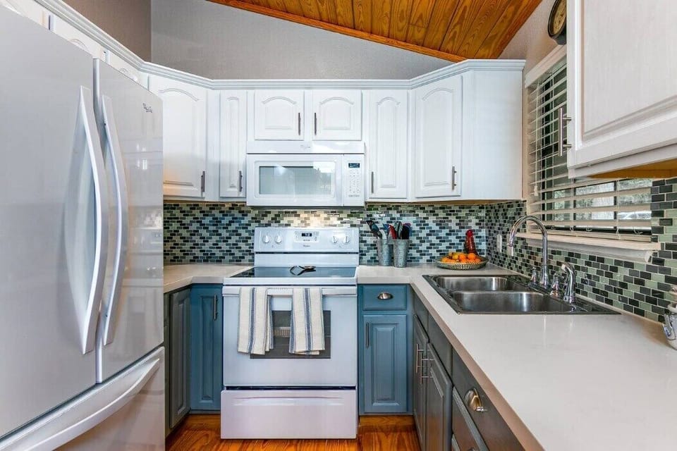 This spotless, fully equipped kitchen has everything you need—whether you're whipping up a quick bite or preparing a full meal. It also features a convenient island with seating for four, perfect for dining or gathering.