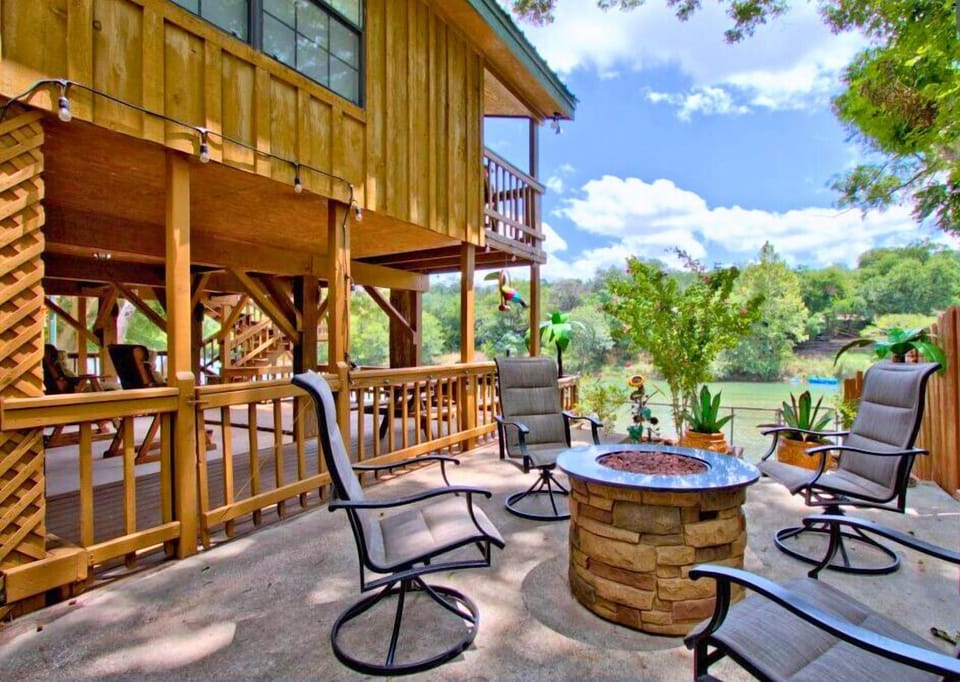 Enjoy the custom fire pit beside the house, offering stunning views of the river.