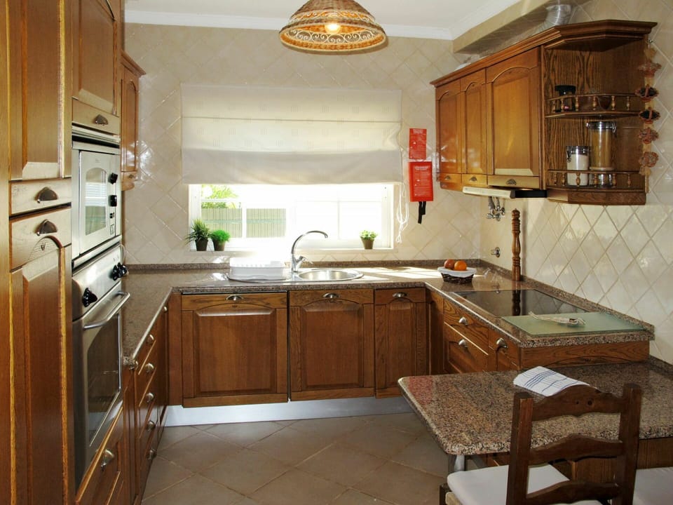 Countertop, Furniture, Cabinetry, Room, Property, Kitchen, Interior Design, Building, Floor, House