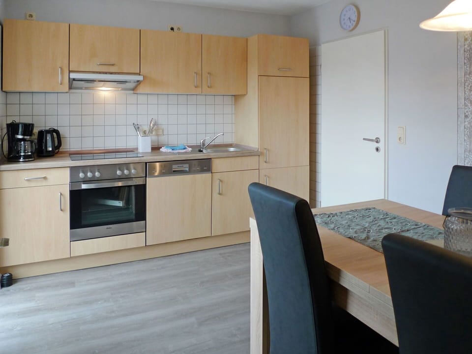 Countertop, Room, Property, Furniture, Kitchen, Cabinetry, Major Appliance, Kitchen Stove, Floor, Building