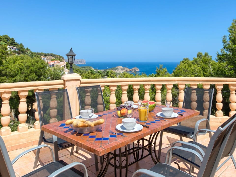 Sky, Table, Furniture, Tableware, Property, Building, Chair, Outdoor Table, Azure, Outdoor Furniture