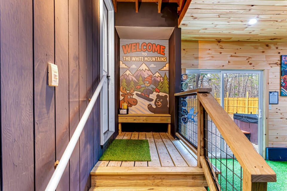 A true White Mountains retreat! The custom mural offers a fun, welcoming first impression for guests and renters alike.