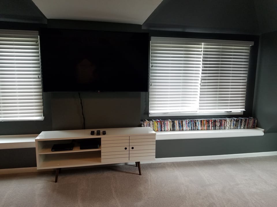 Attic Theater Room with 65" TV, DVD player and over 180 DVD's