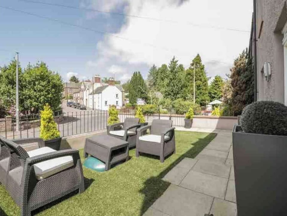 Relaxed  seating area at the front of the house looking up through the village.