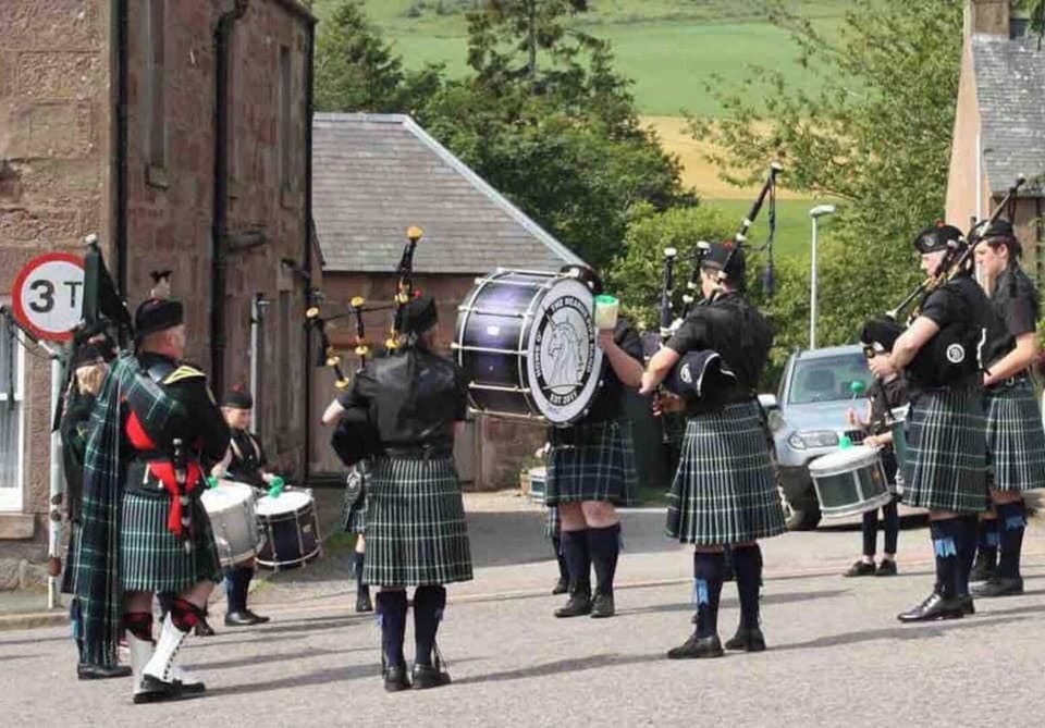 Pipers in the village square 