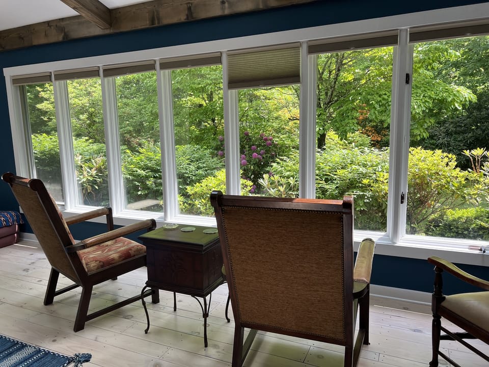 In the spring, the house is surrounded by flowering trees.