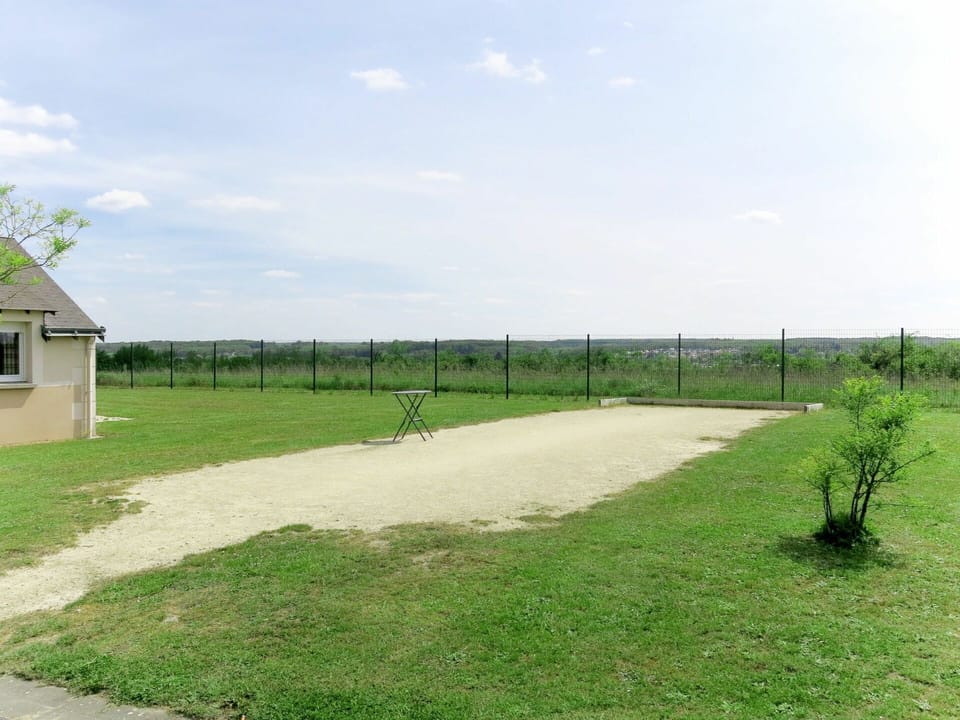 Sky, Cloud, Ecoregion, Fence, Land Lot, Grass, Asphalt, Road Surface, Grassland, Plain