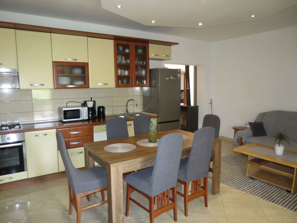Table, Furniture, Cabinetry, Countertop, Chair, Kitchen Appliance, Couch, Wood, Interior Design, Lighting