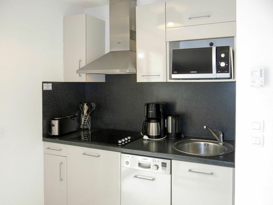 Countertop, Room, Property, Kitchen, Cabinetry, Furniture, Interior Design, Kitchen Stove, House, Building