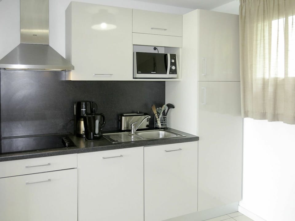 Countertop, Room, Kitchen, Cabinetry, Property, Furniture, Kitchen Stove, Interior Design, Major Appliance, Kitchen Appliance