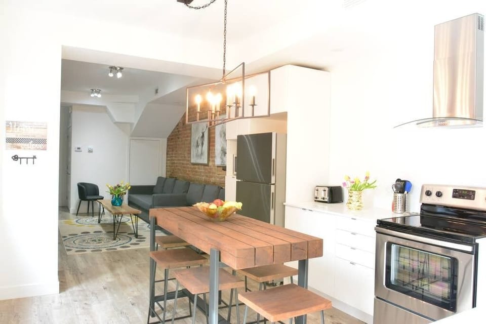 Kitchen table sits 6 people. Another table is available if you need to sit more people. It is located in the front bedroom.