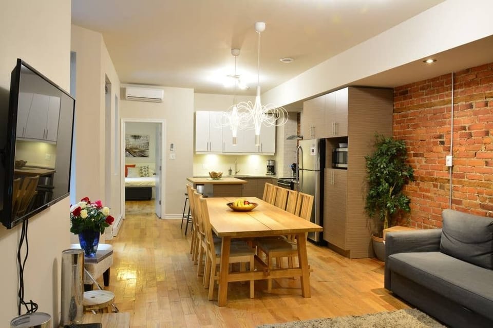 There are extra chairs in the bedrooms for the dining table.