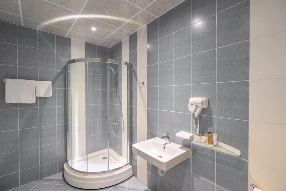Shower, free toiletries, hair dryer, slippers