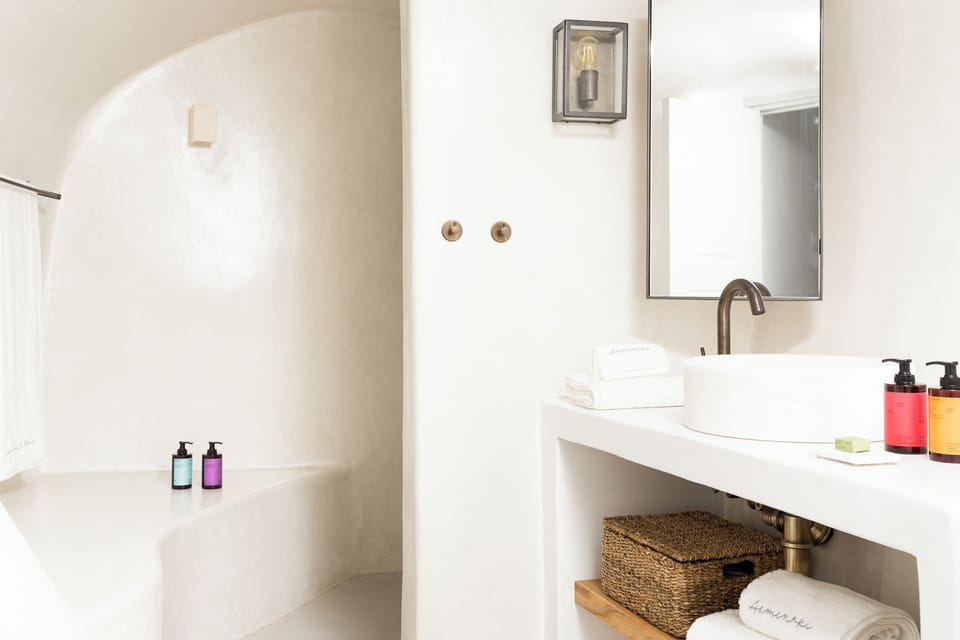 Caldera Residence | Bathroom | Shower, free toiletries, hair dryer, bathrobes