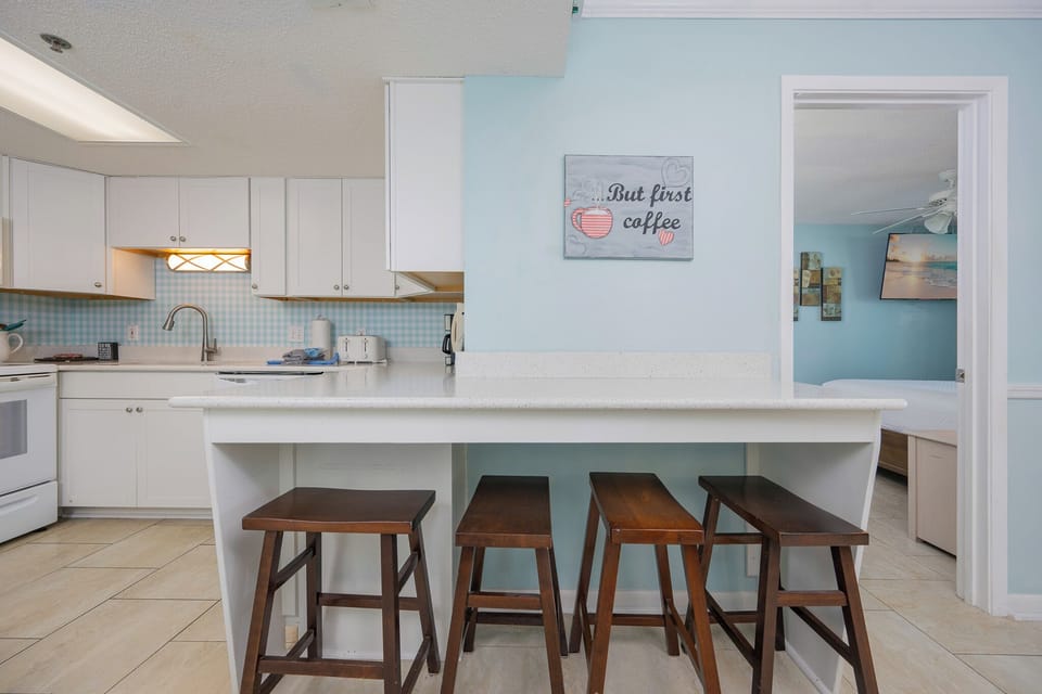 Start your day sipping coffee at the kitchen bar, surrounded by cheerful decor and easy access to family fun