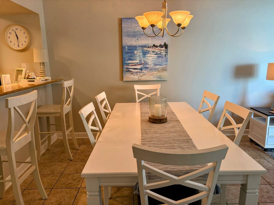 Dining area with seating for six and extra bar stools