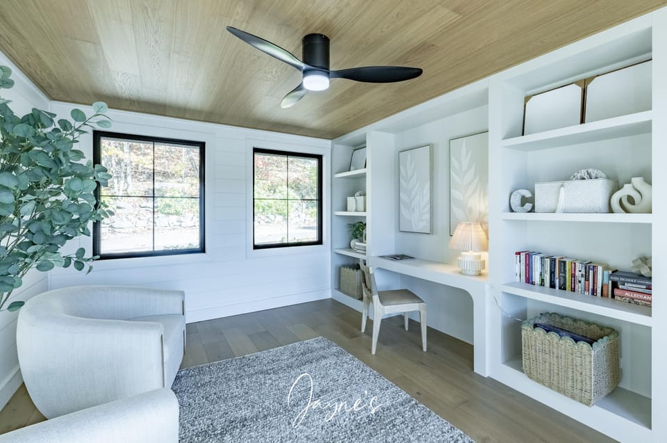 Bright and airy sunroom with cozy reading nook and built-ins