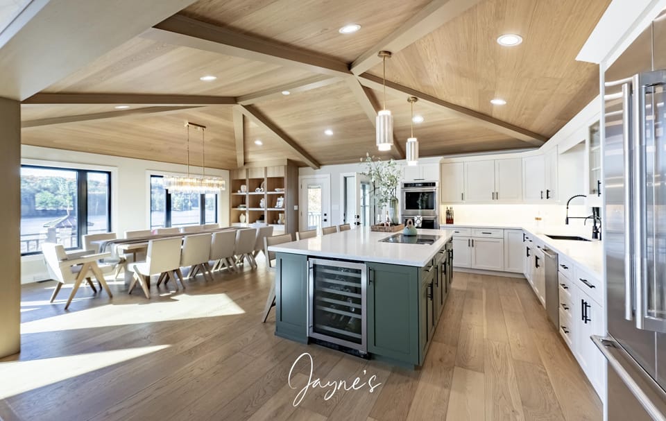 Spacious kitchen and dining area with vaulted ceilings and natural light