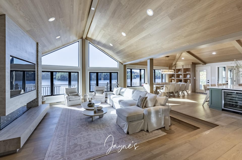 Spacious living room with panoramic windows and cozy seating