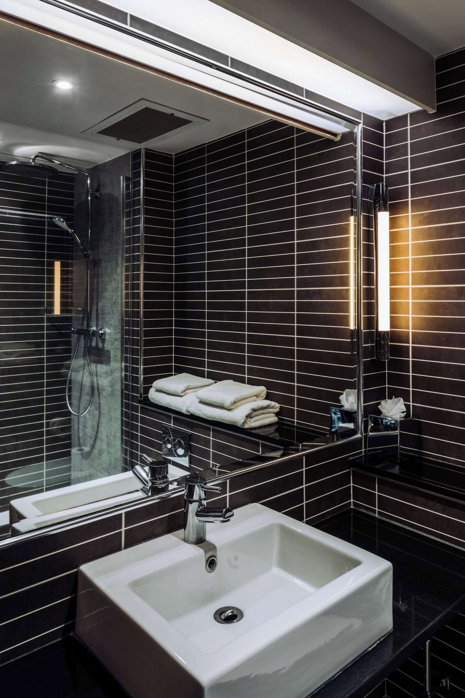 Shower, rainfall showerhead, designer toiletries, hair dryer