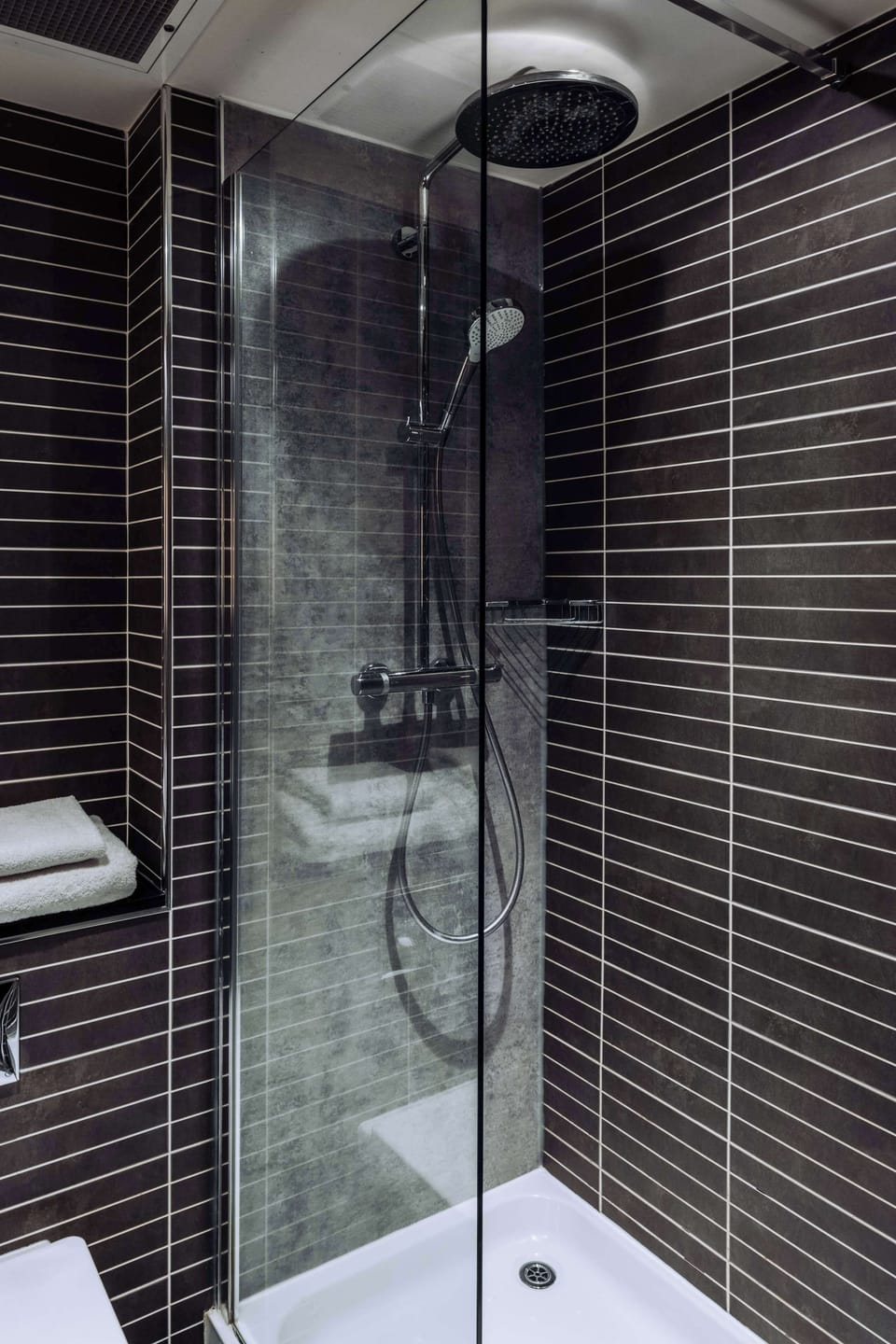 Hypo-allergenic bedding, desk, laptop workspace, blackout drapes