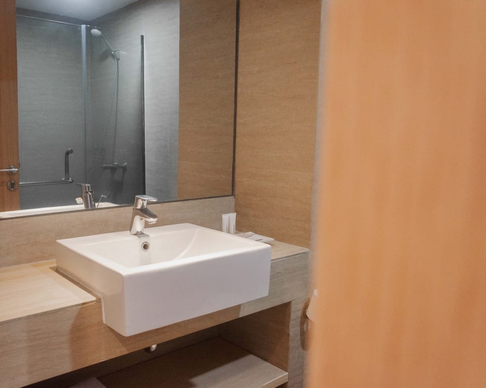 Shower, slippers, bidet, towels