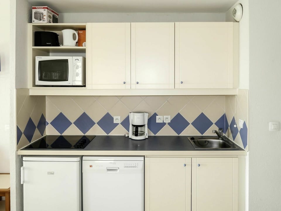 Cabinetry, Room, Kitchen, Countertop, Furniture, Property, Cupboard, Laundry Room, Material Property, Major Appliance