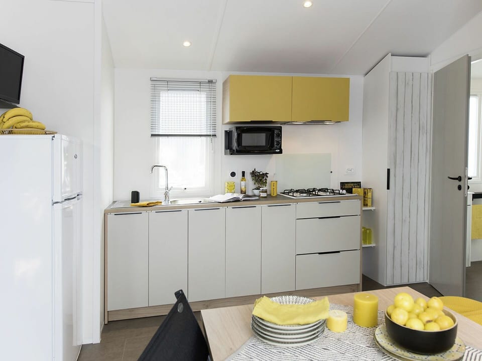 Room, Yellow, Property, Furniture, Kitchen, Countertop, Cabinetry, Interior Design, Floor, Building