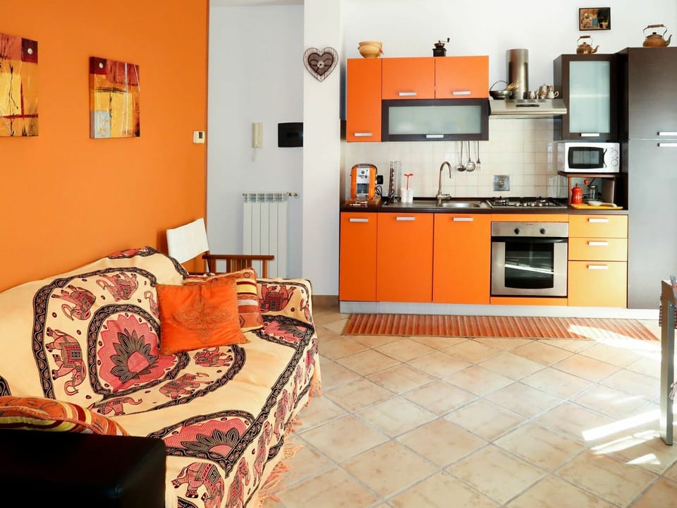 Room, Orange, Furniture, Property, Interior Design, Floor, Yellow, Living Room, Building, Kitchen
