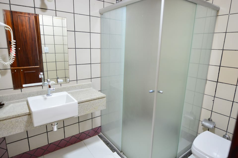 Shower, rainfall showerhead, hair dryer, towels
