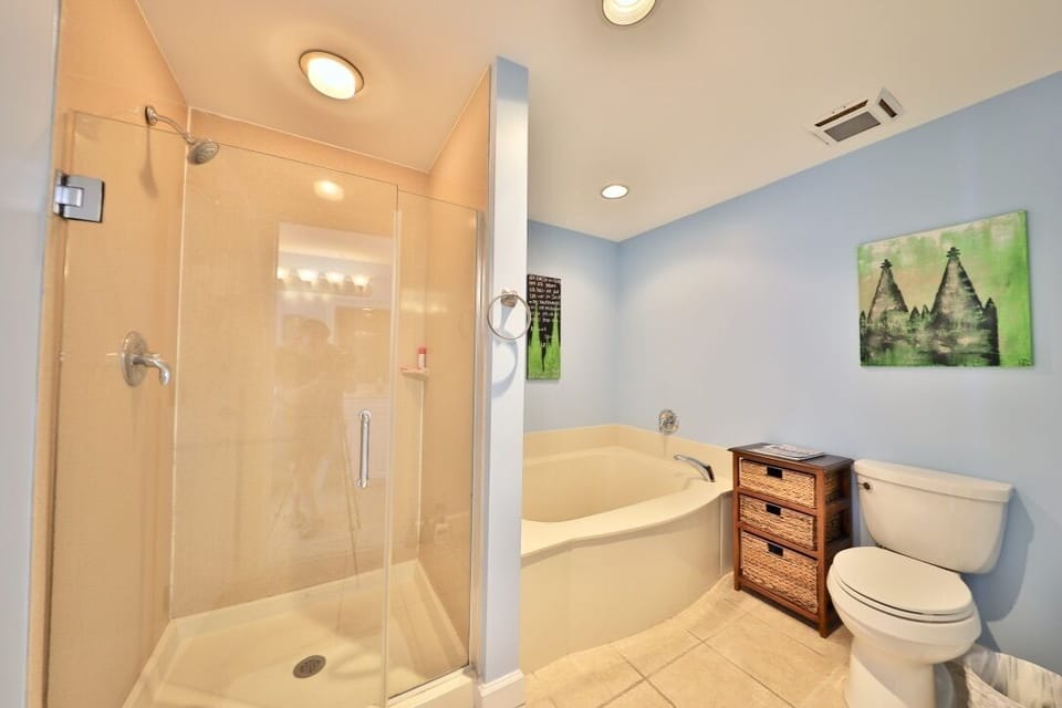 Separate shower and tub in the master bathroom.