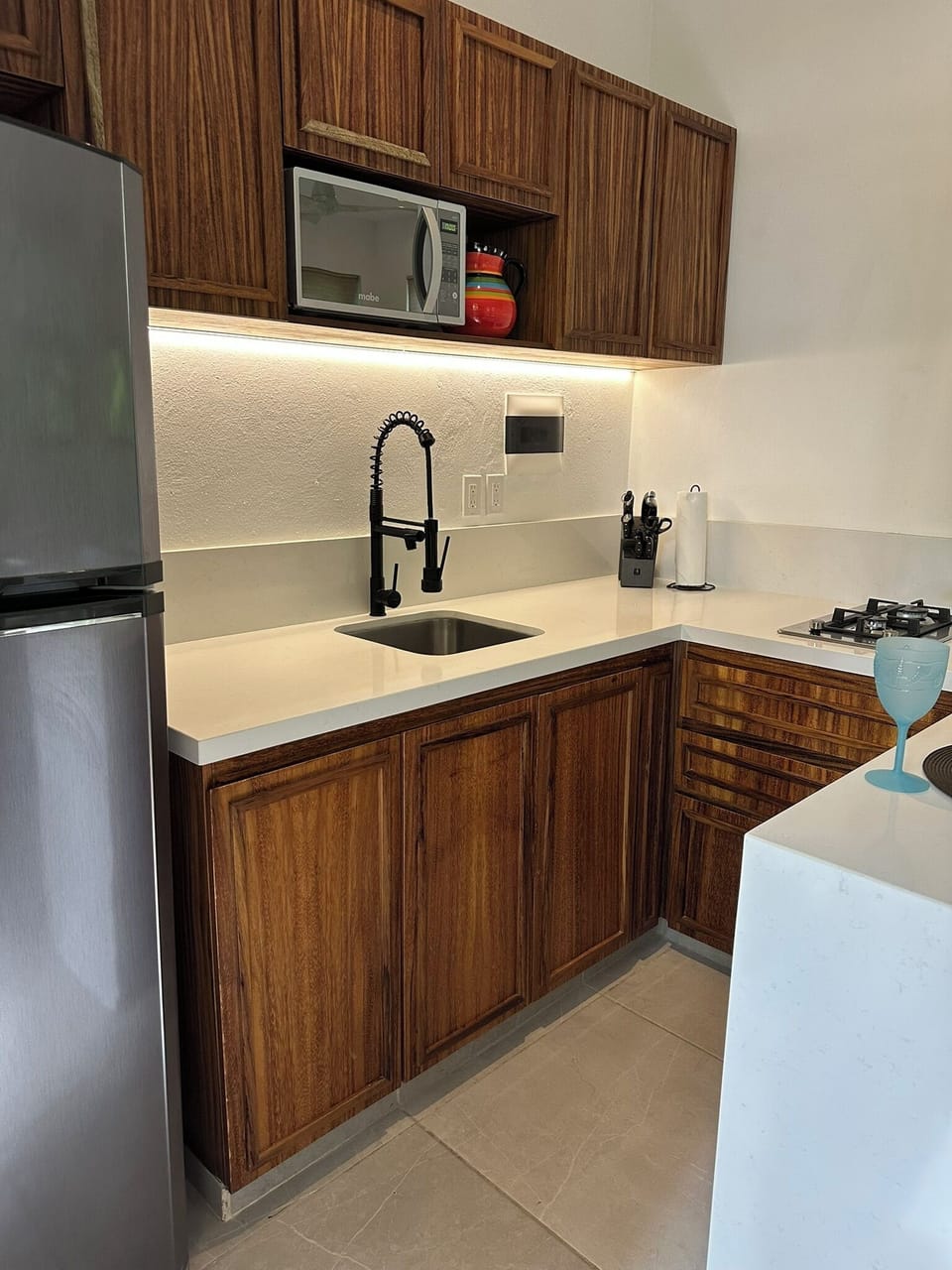 Roomy kitchen with gas cooktop.  All the utensils you need.  Weber grill outside