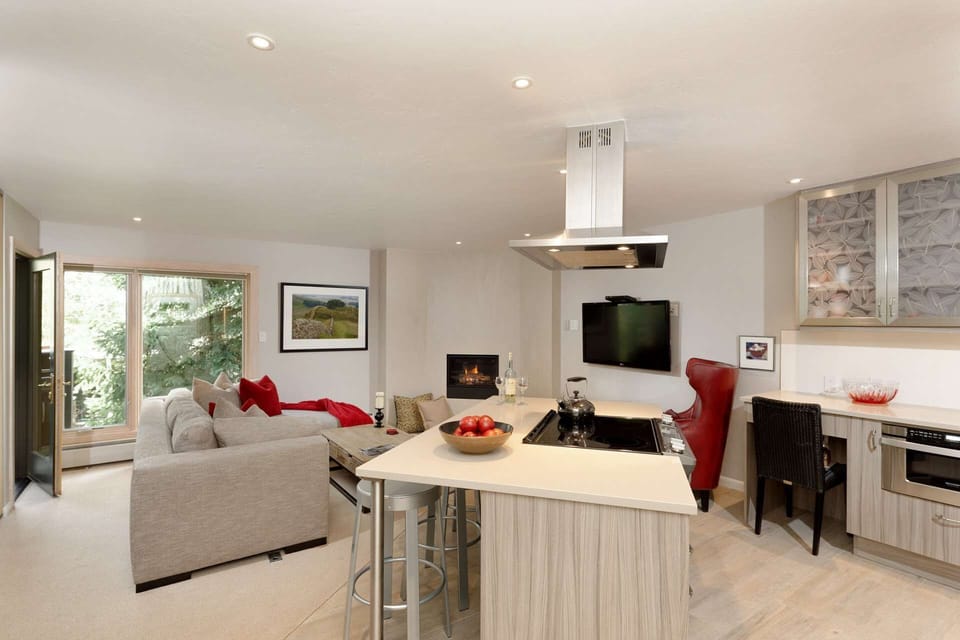 Warm tones and inviting furnishings create a welcoming space for you to spend time with your friends or family.