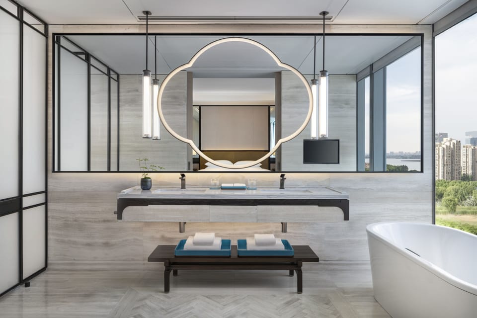 Separate tub and shower, rainfall showerhead, designer toiletries