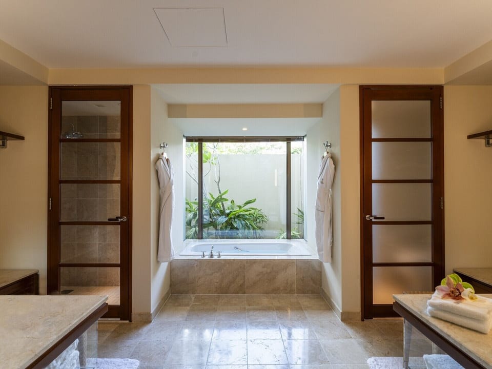 Premier Garden Suite, with Club Service, Non Smoking - Adult Only 13 or over | Bathroom | Combined shower/tub, rainfall showerhead, free toiletries, hair dryer