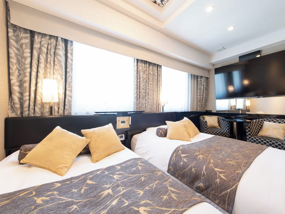 Deluxe Twin Room, Non Smoking | Down comforters, desk, blackout drapes, iron/ironing board