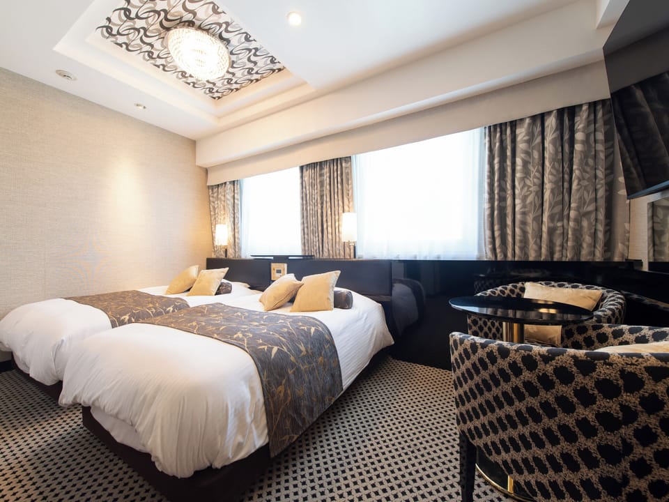 Deluxe Twin Room, Non Smoking | Down comforters, desk, blackout drapes, iron/ironing board