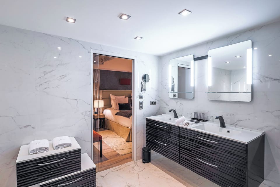 Suite Commanderie | Bathroom | Designer toiletries, hair dryer, bathrobes, slippers
