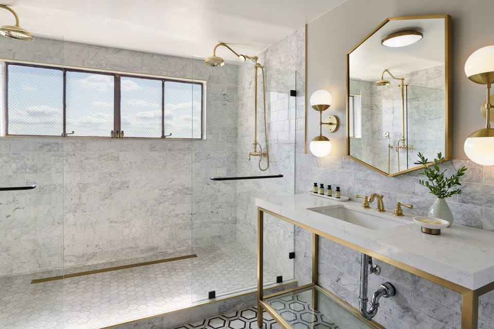 Shower, rainfall showerhead, designer toiletries, hair dryer