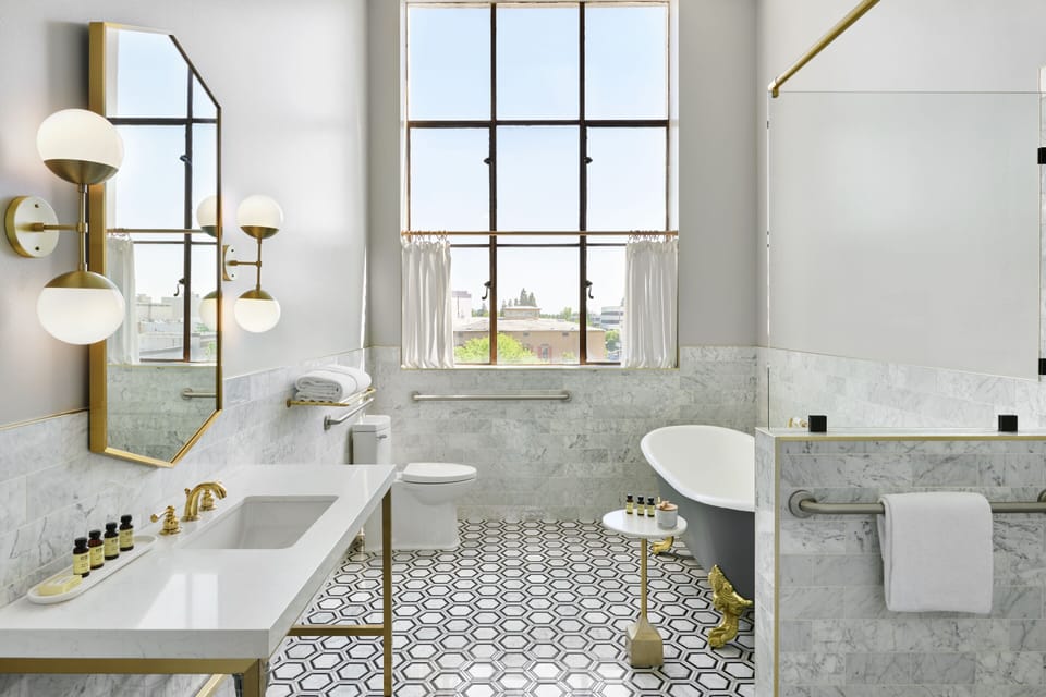 Shower, rainfall showerhead, designer toiletries, hair dryer