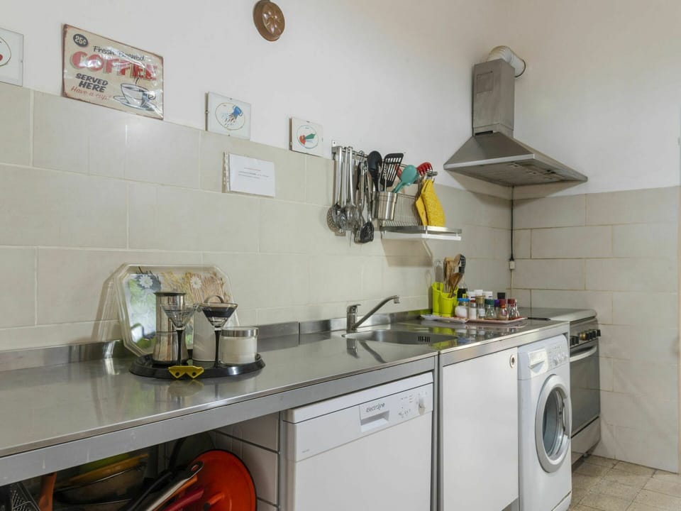 Tap, Kitchen Sink, Cabinetry, Property, Sink, Countertop, Plumbing Fixture, Kitchen Appliance, Kitchen Stove, Interior Design