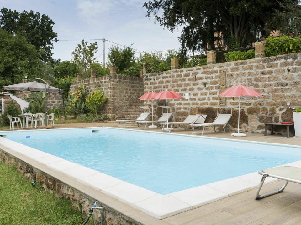 Water, Furniture, Property, Plant, Building, Sky, Swimming Pool, Tree, Chair, Shade