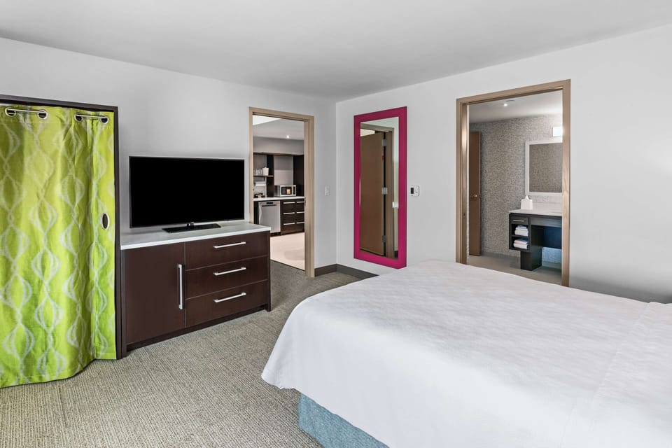 Suite, 1 Queen Bed, Accessible (Mobility & Hearing, Roll-in Shower) | Desk, laptop workspace, blackout drapes, iron/ironing board