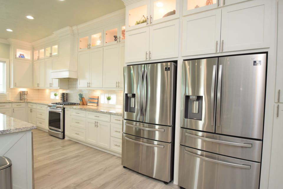 2 refrigerators with water and ice dispensors