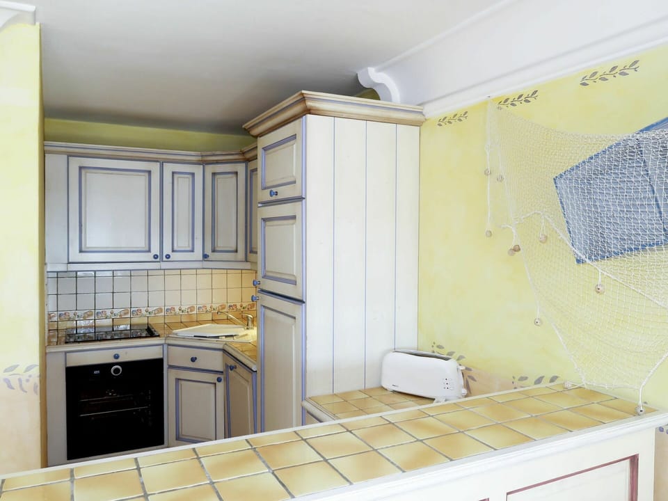 Room, Property, Tile, Kitchen, Interior Design, Cabinetry, Furniture, Yellow, Countertop, Ceiling
