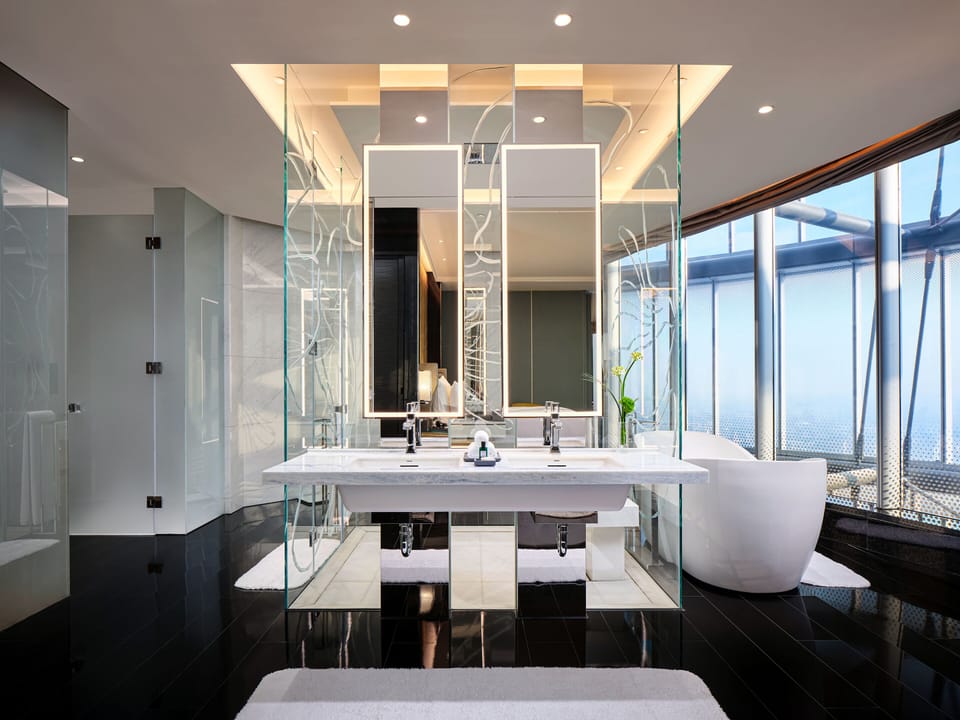 Separate tub and shower, rainfall showerhead, designer toiletries