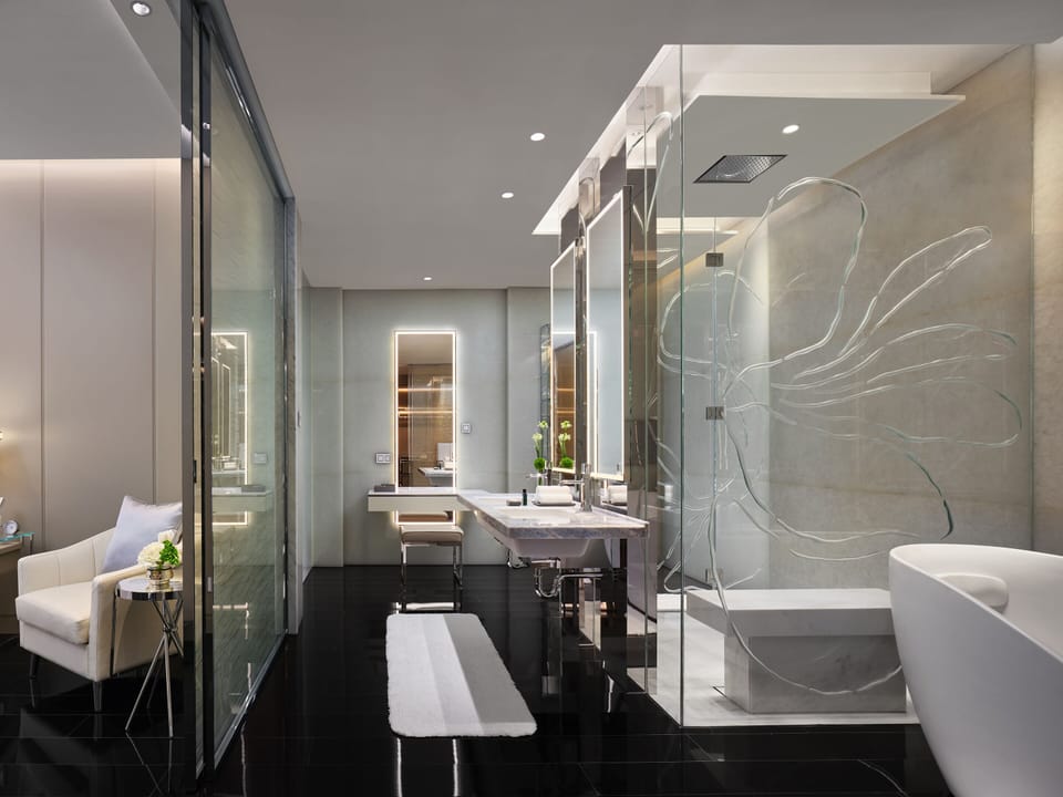 Separate tub and shower, rainfall showerhead, designer toiletries